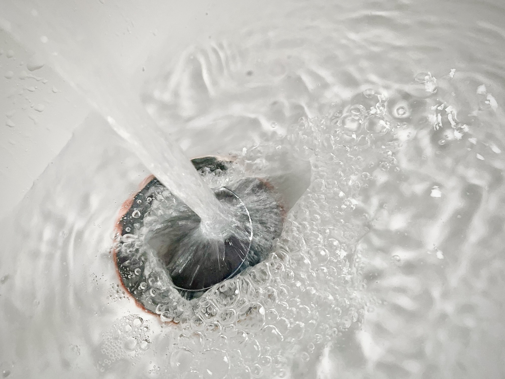 Water running down a the sink hole